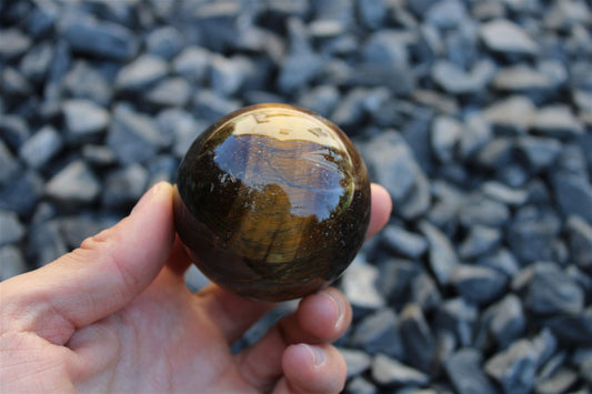 1 sphère oeil de tigre et support bois 5.6 cm - Aurore Lune