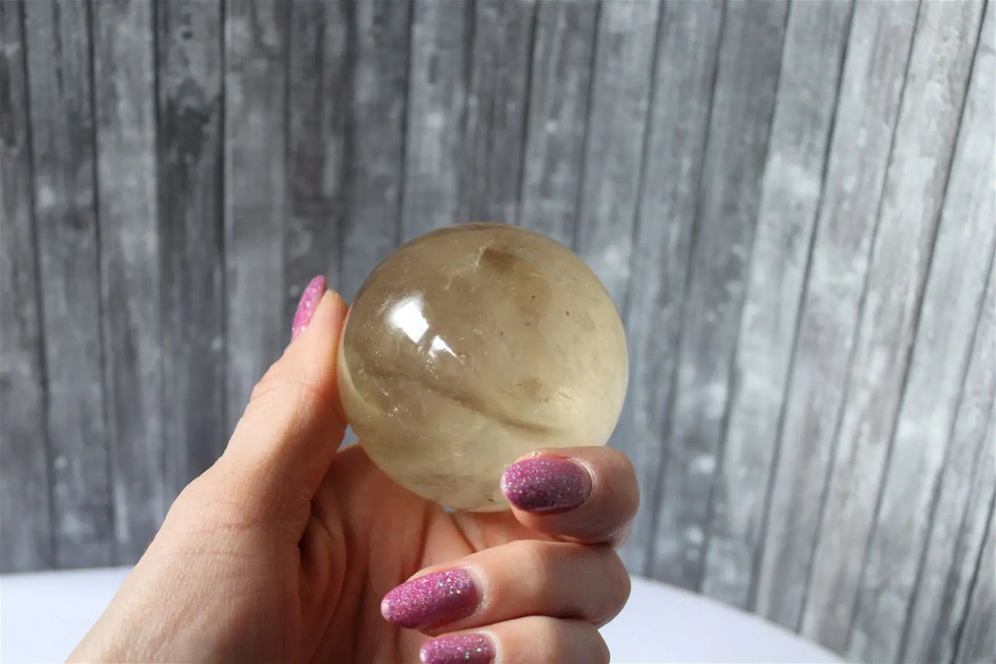 Sphère de citrine 6.5 cm - 295 grammes avec socle doré - Aurore Lune