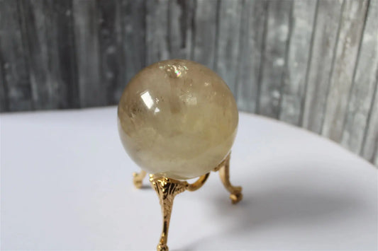 Sphère de citrine 6.5 cm - 295 grammes avec socle doré - Aurore Lune