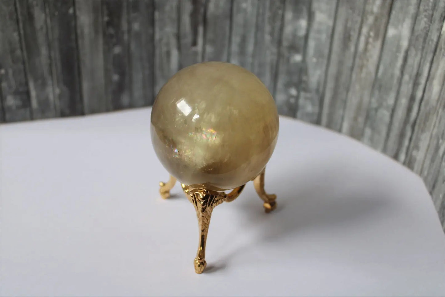 Sphère de citrine 6.5 cm - 295 grammes avec socle doré - Aurore Lune