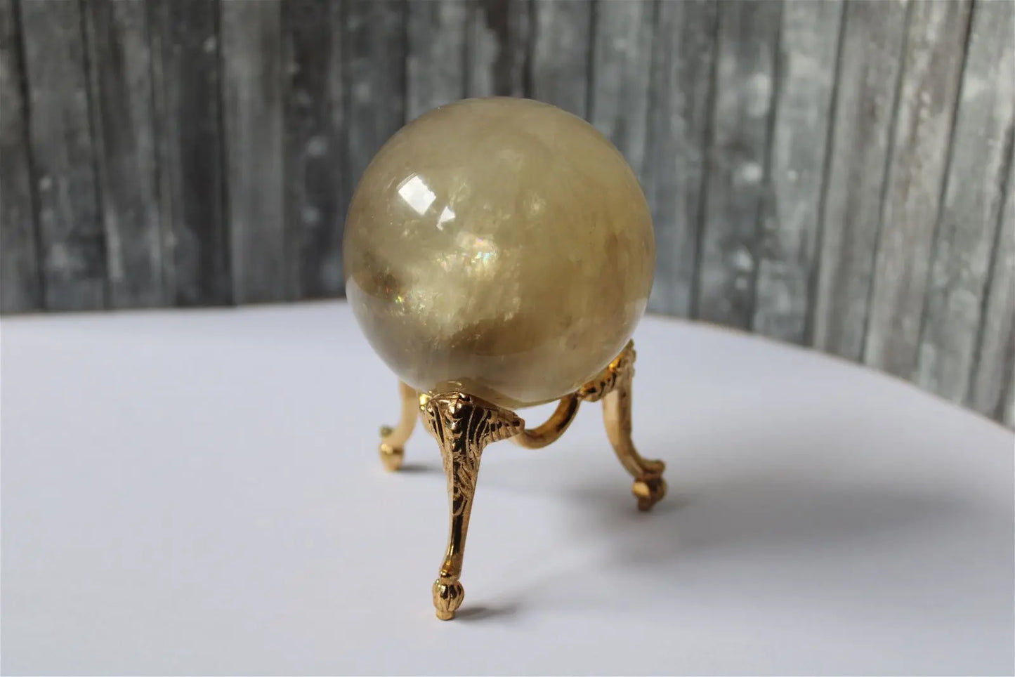 Sphère de citrine 6.5 cm - 295 grammes avec socle doré - Aurore Lune