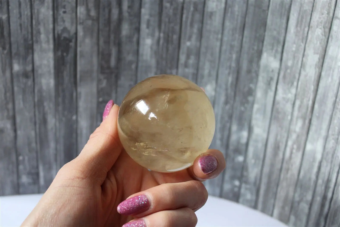 Sphère de citrine 6.5 cm - 295 grammes avec socle doré - Aurore Lune