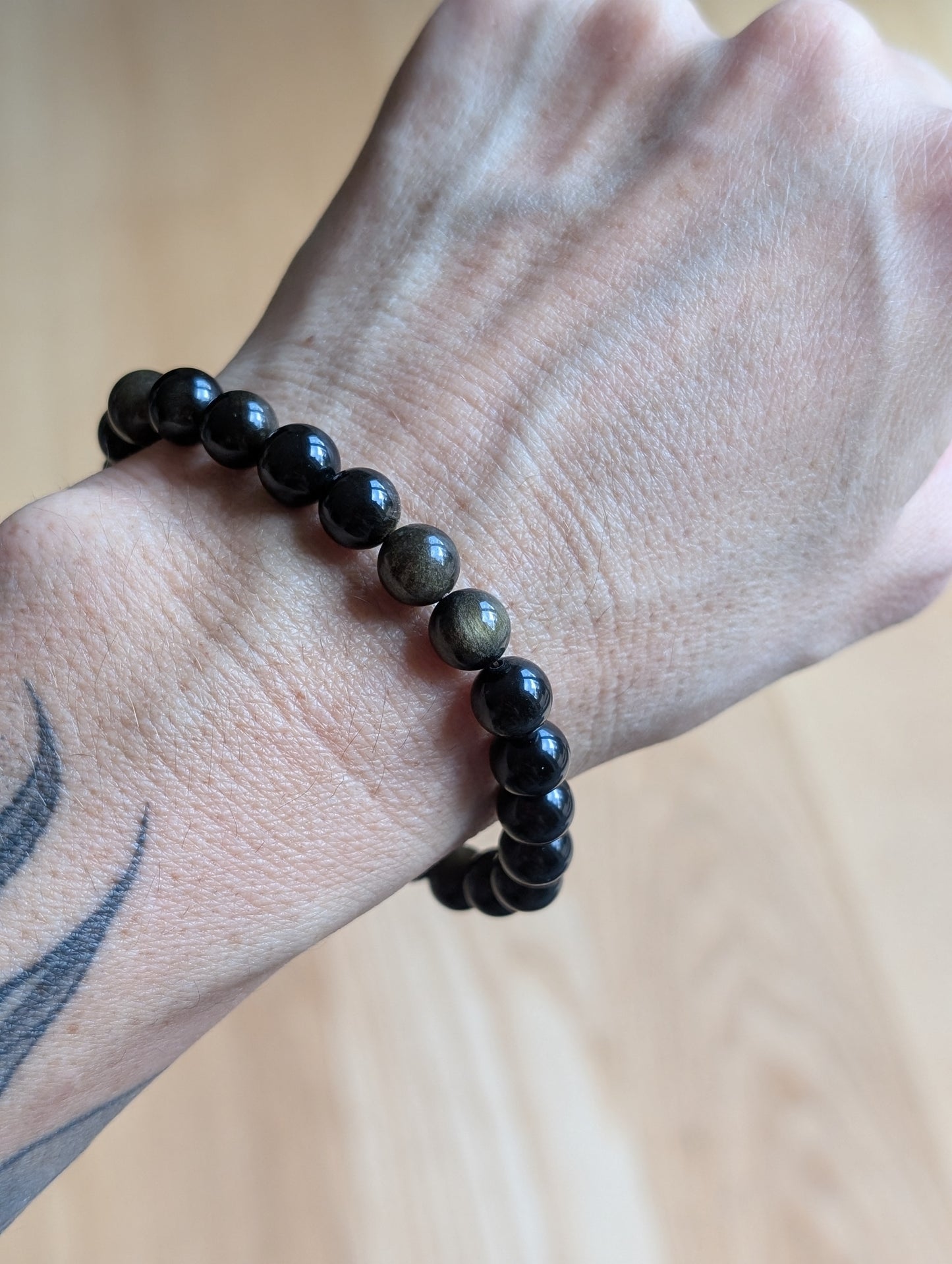 1 bracelet en obsidienne dorée 17 cm