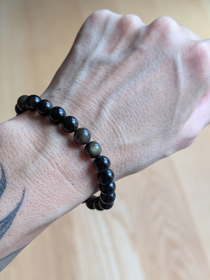 1 bracelet en obsidienne dorée 17 cm